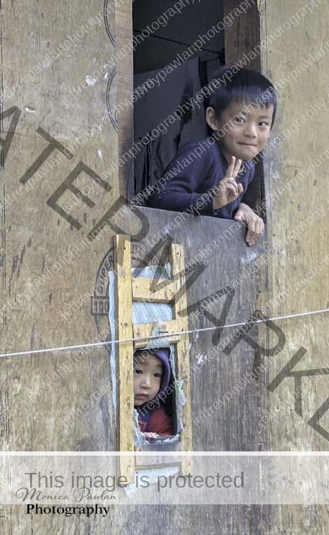 Indian-children-workers-peering-out-of-their-enclosure-PXL_20241128_023922457-signed-WP-472x768